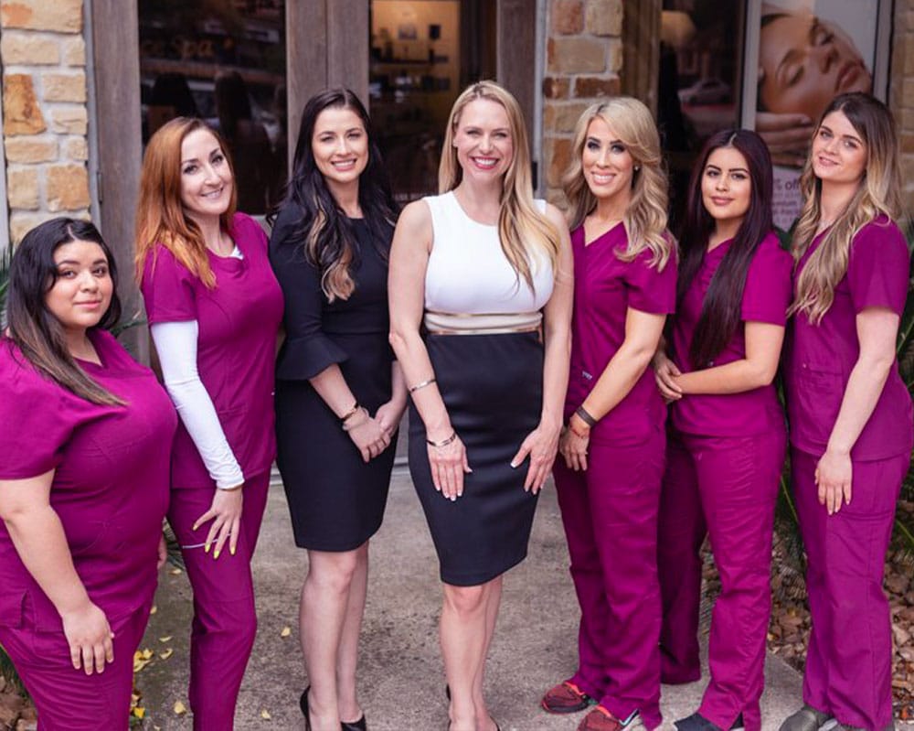 a group of people posing for a photo