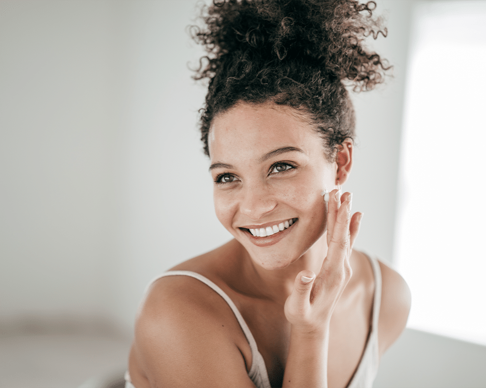 a woman who is smiling and looking at the camera