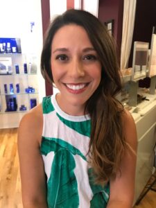 a little girl smiling at the camera