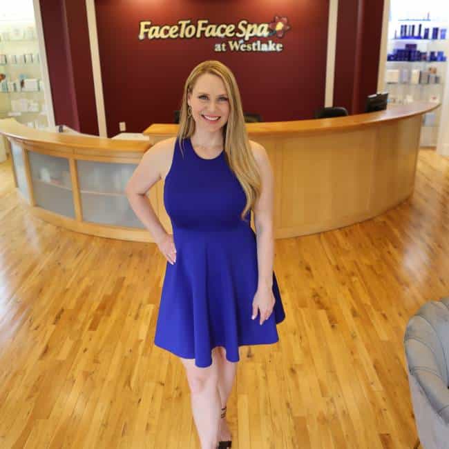 Keghan Hurst standing in front of a hard wood floor