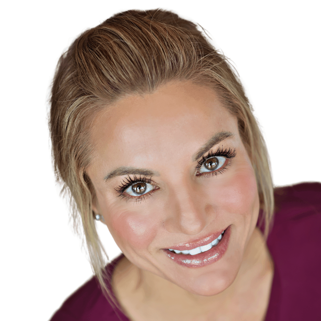 a woman wearing glasses and smiling at the camera