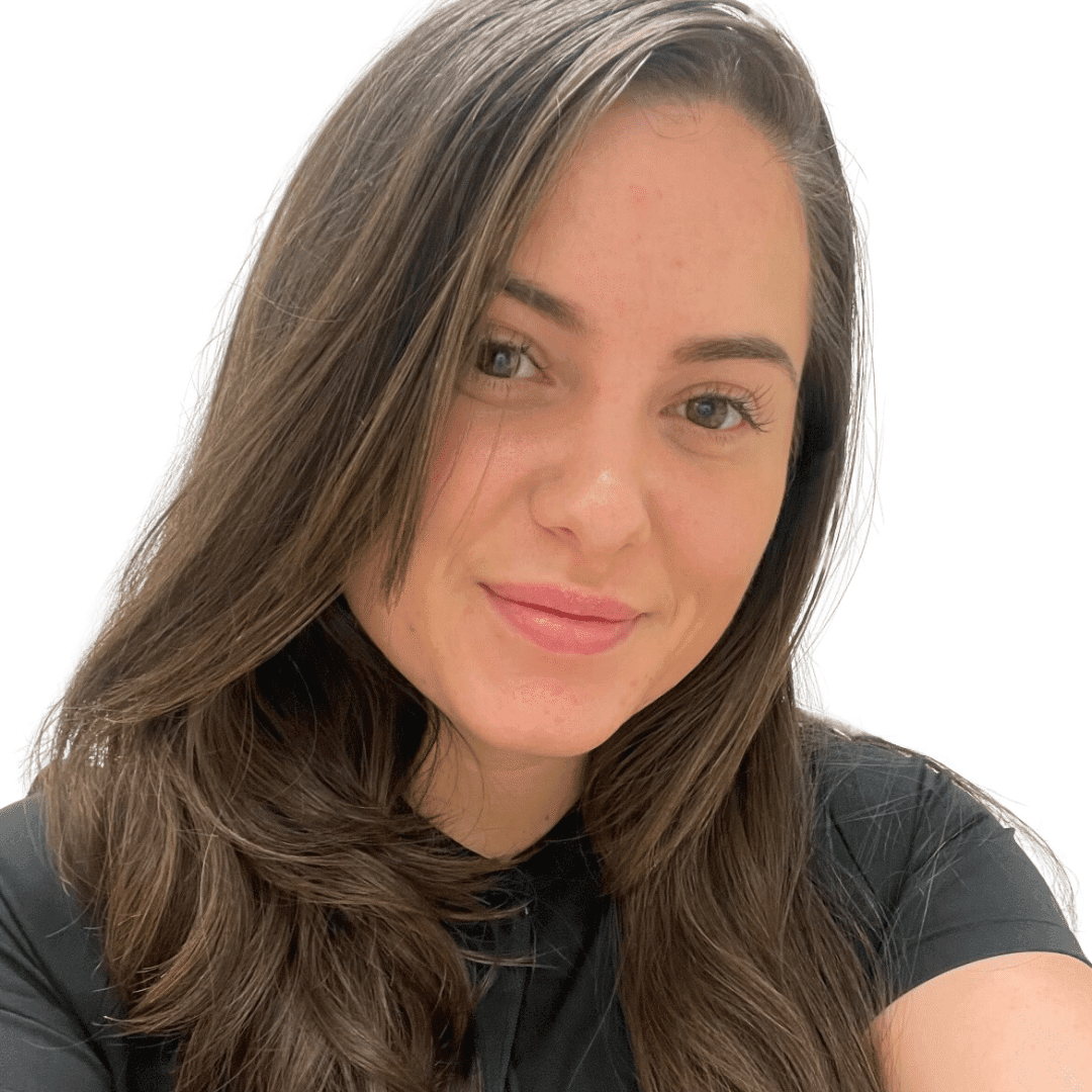 a woman wearing glasses and smiling at the camera