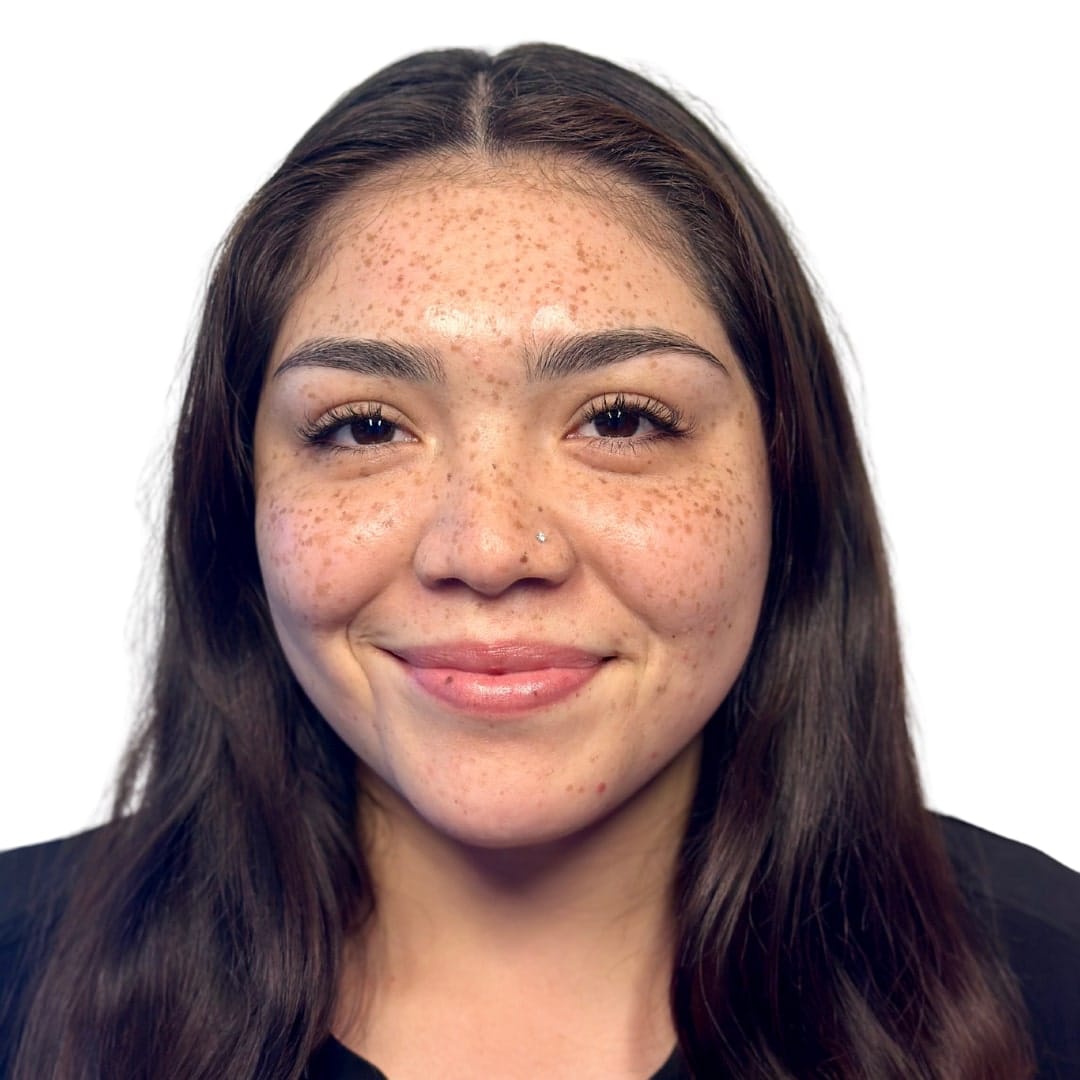 a close up of a person smiling for the camera