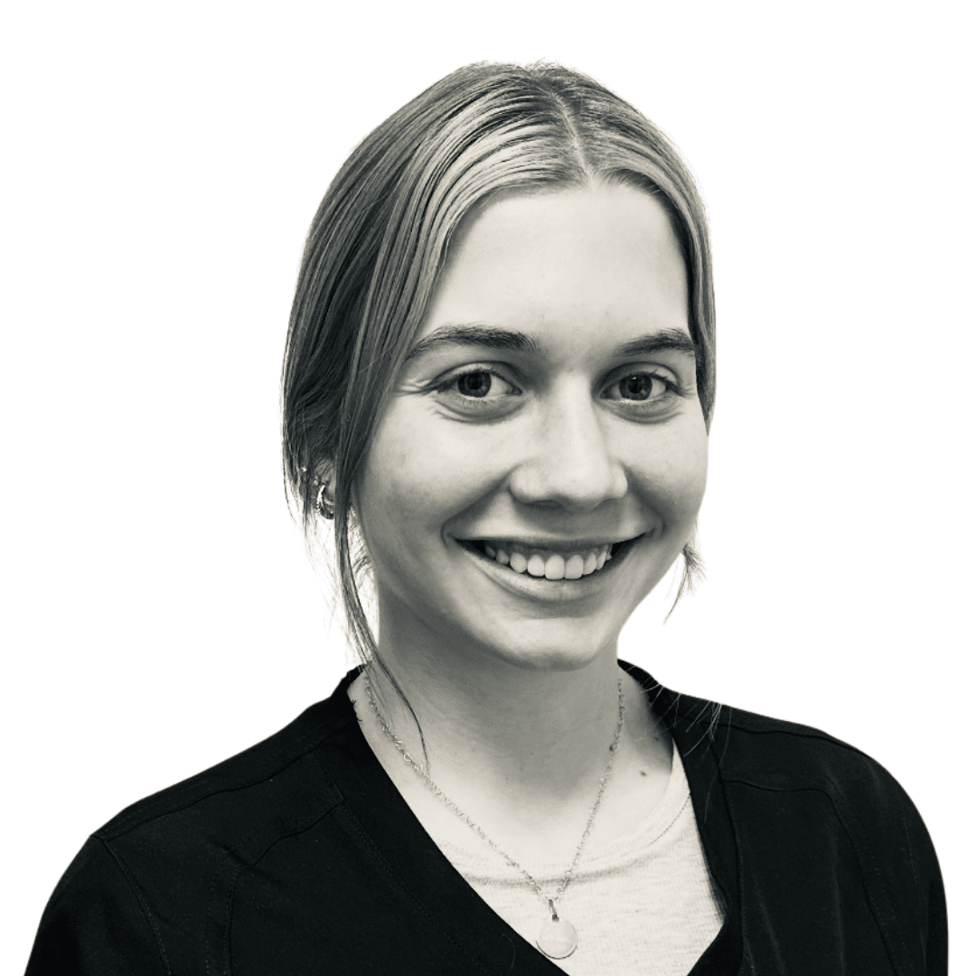 a woman smiling and posing for the camera