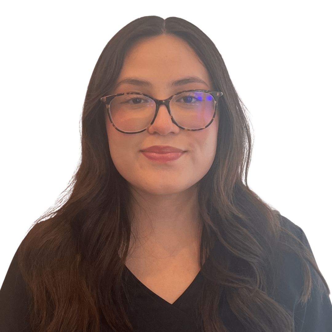 a woman wearing glasses and smiling at the camera